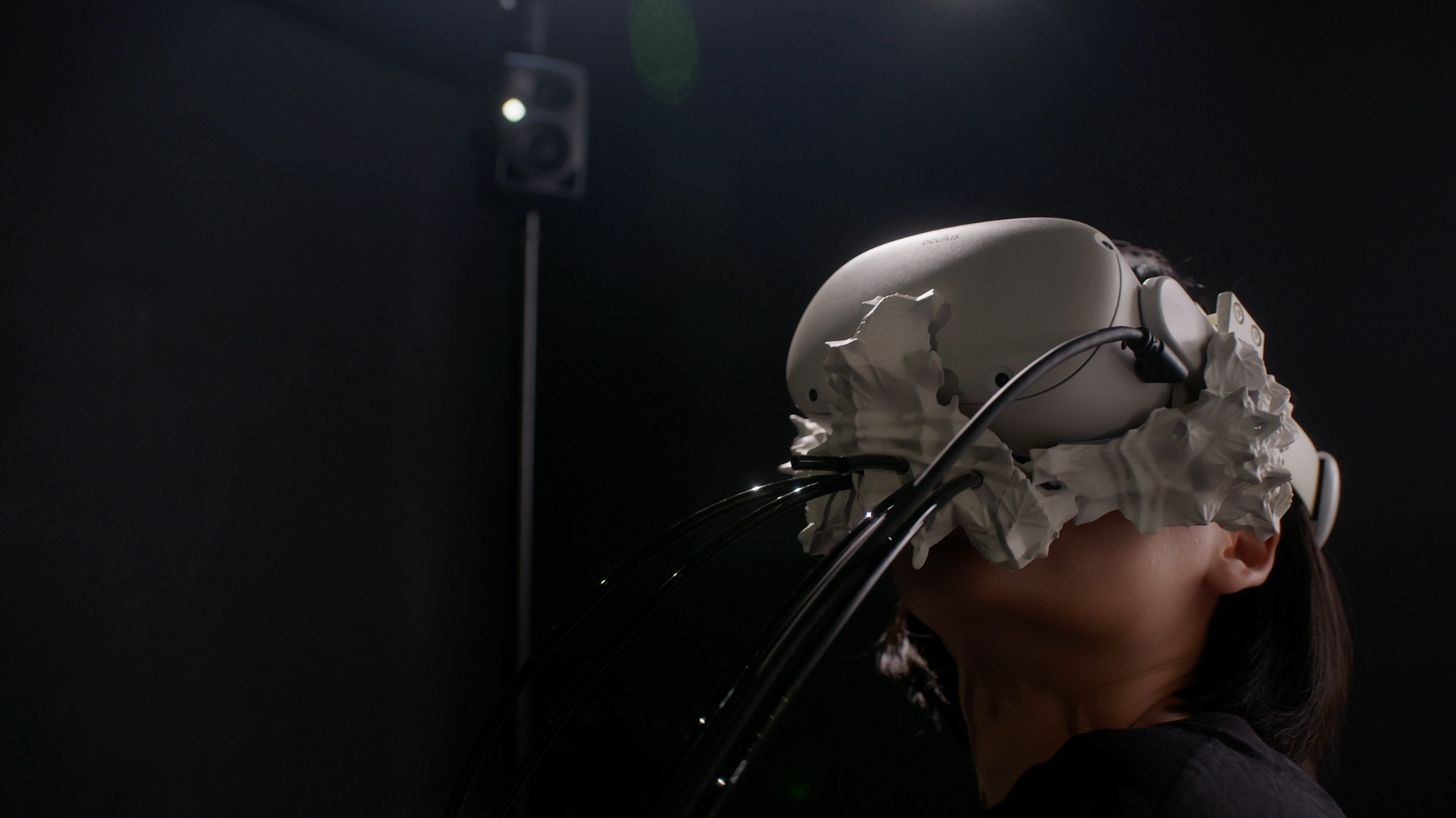 Viewer wearing custom 3D-printed haptic VR rig